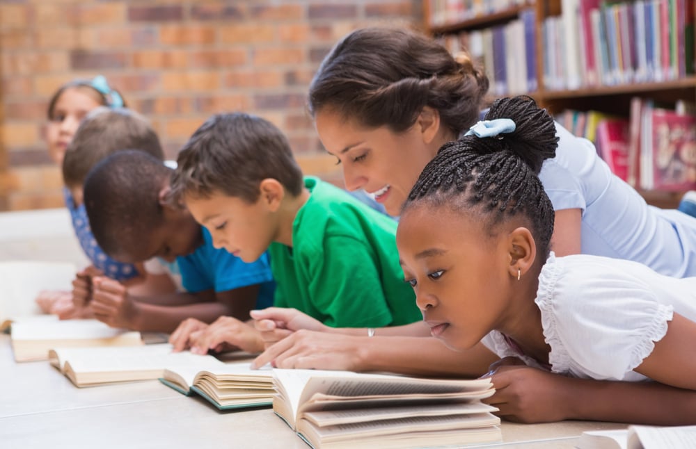 Teacher working with students.